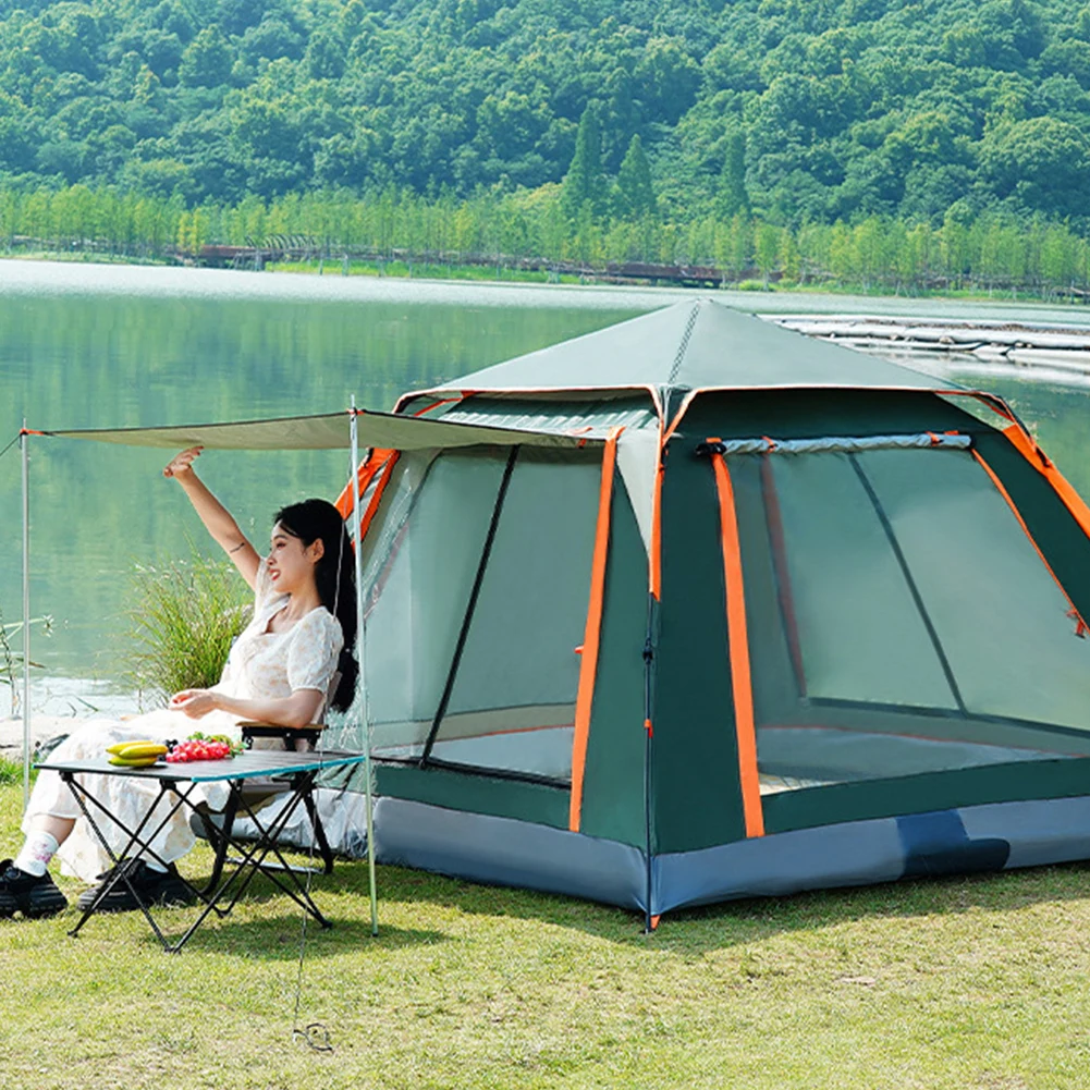 Girl relaxing at the door of the outdoor camping tent