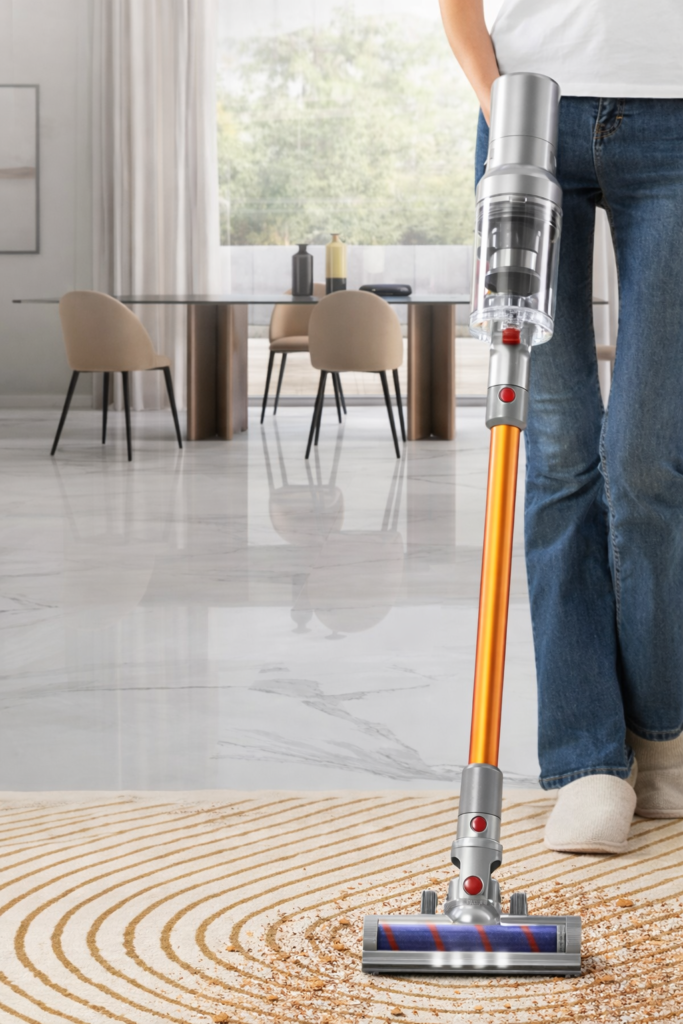 someone with a vacuum cleaner cleaning the floor