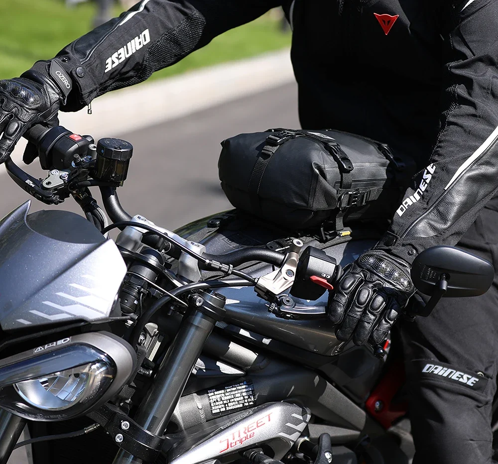 man riding motorcycle with tank vest