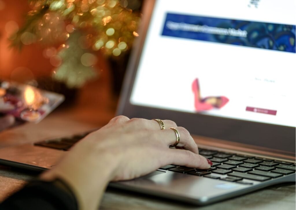 A hand typing on a notebook keyboard