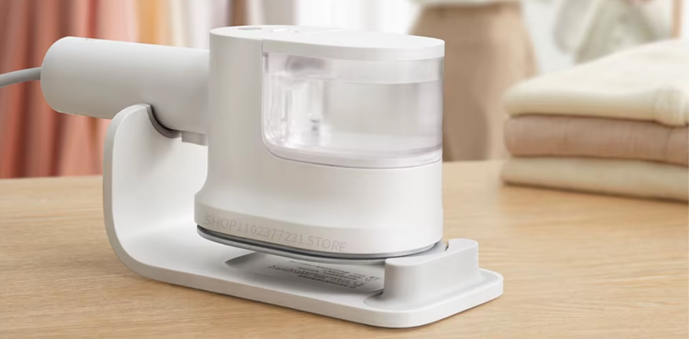 white handheld steam with water container